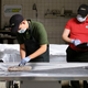 A Subway trainee struggles to recognize and classify the various meats present in his Cold Cut Combo cadaver.